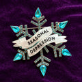 Seasonal Depression, diamanté snowflake pin.