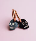 Black and gold mini skull earrings
