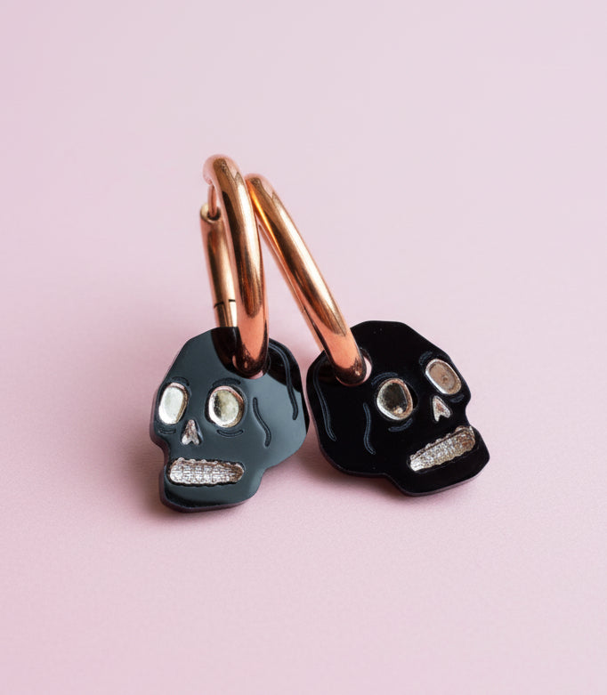 Black and gold mini skull earrings