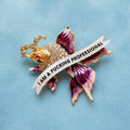 I am a fucking professional, diamanté fish pin