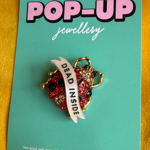 Dead Inside, ladybird pin