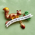 Off to live in the woods, red squirrel pin