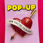 SHOT THROUGH THE HEART… and you’re to blame. Enamel pin.
