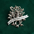 How your email finds me, withered up skull pin.