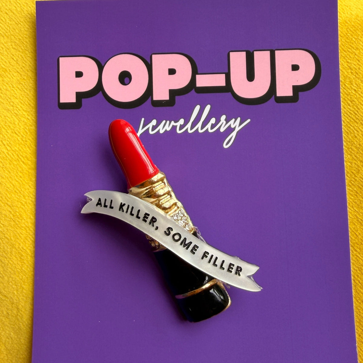 All Killer (some filler) mini lipstick pin.