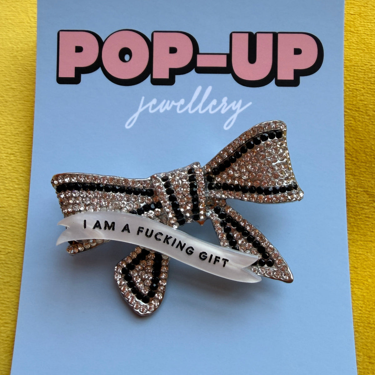 I Am a FUCKING GIFT, diamanté bow pin