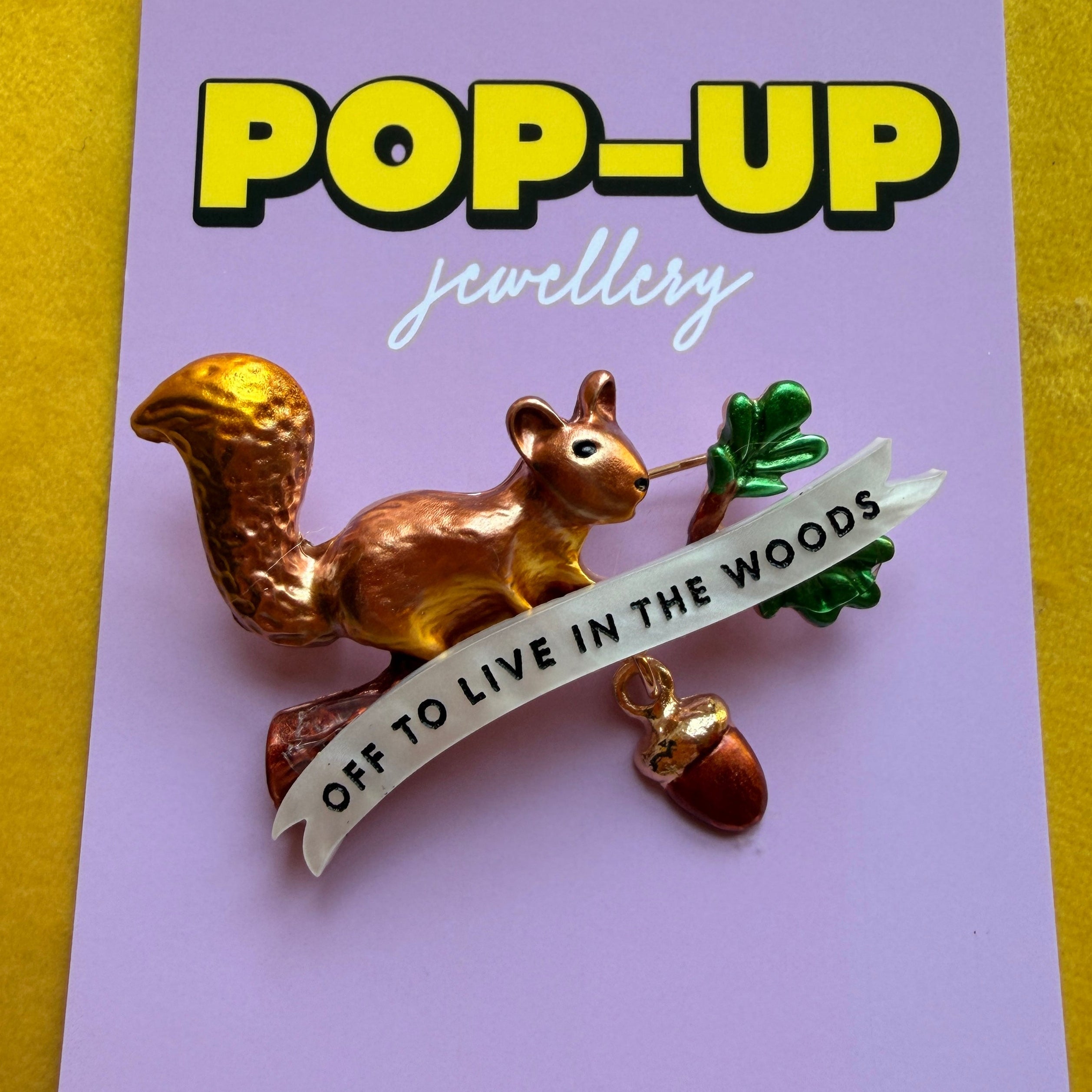 Off to live in the woods, red squirrel pin