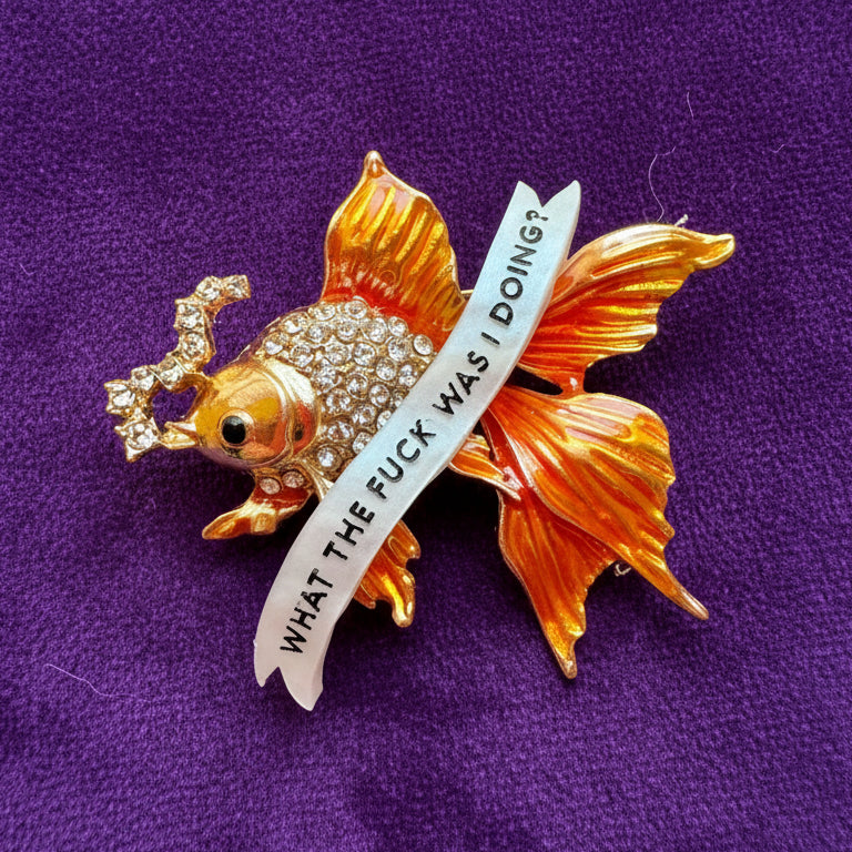 Menopausal goldfish pin.