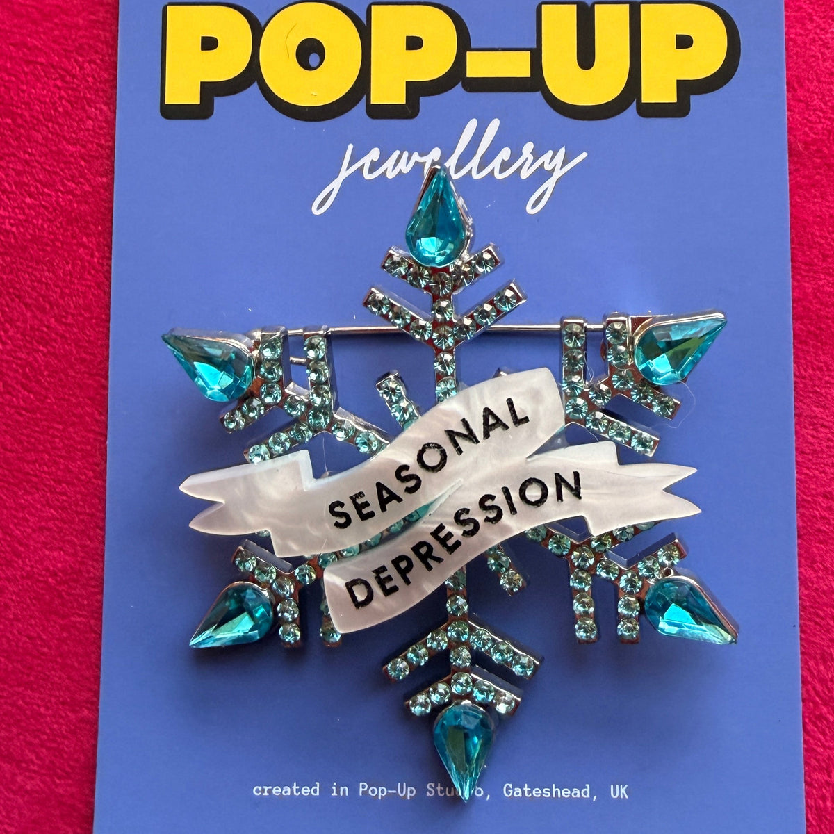 Seasonal Depression, diamanté snowflake pin.