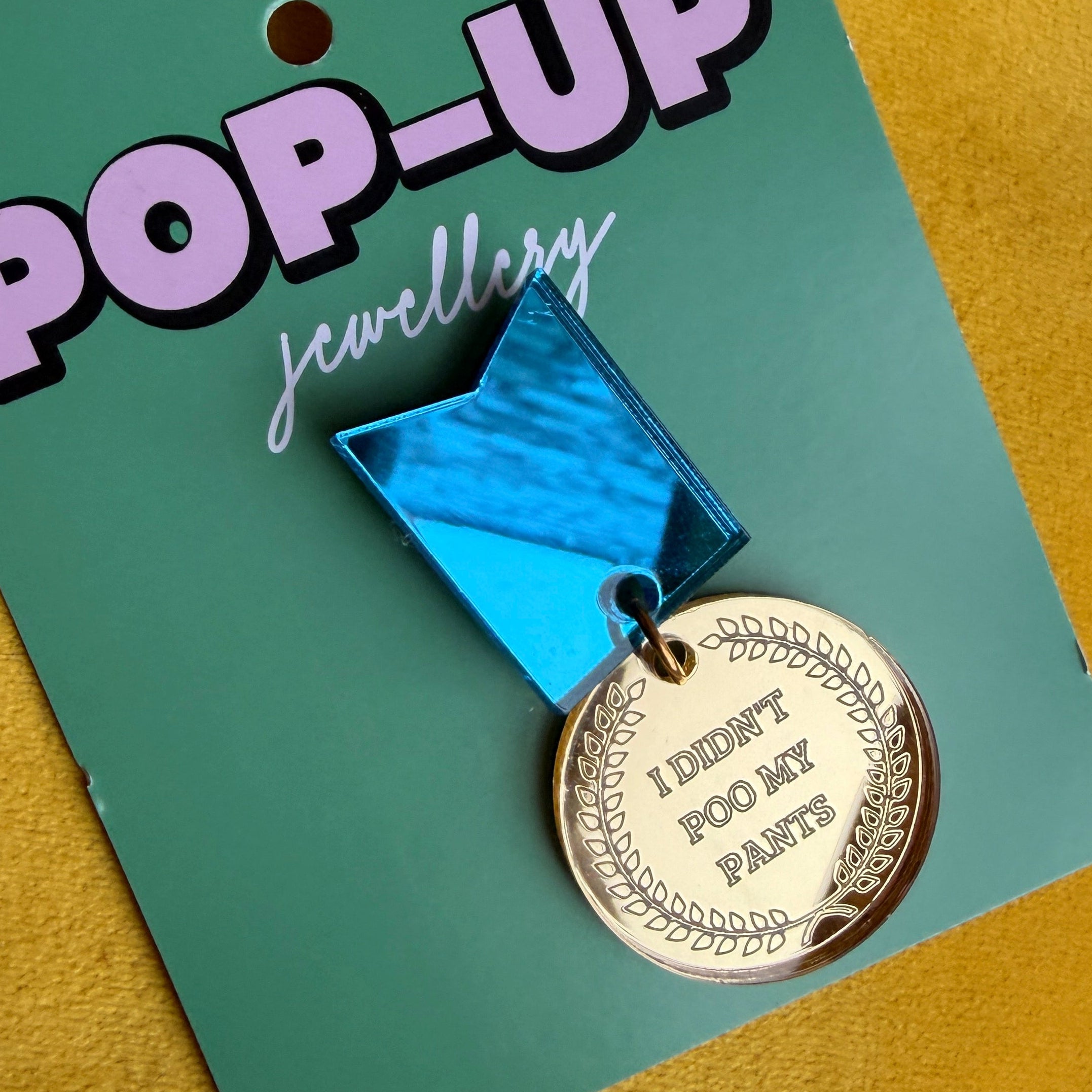 I DIDN’T POO MY PANTS, gold medal pin