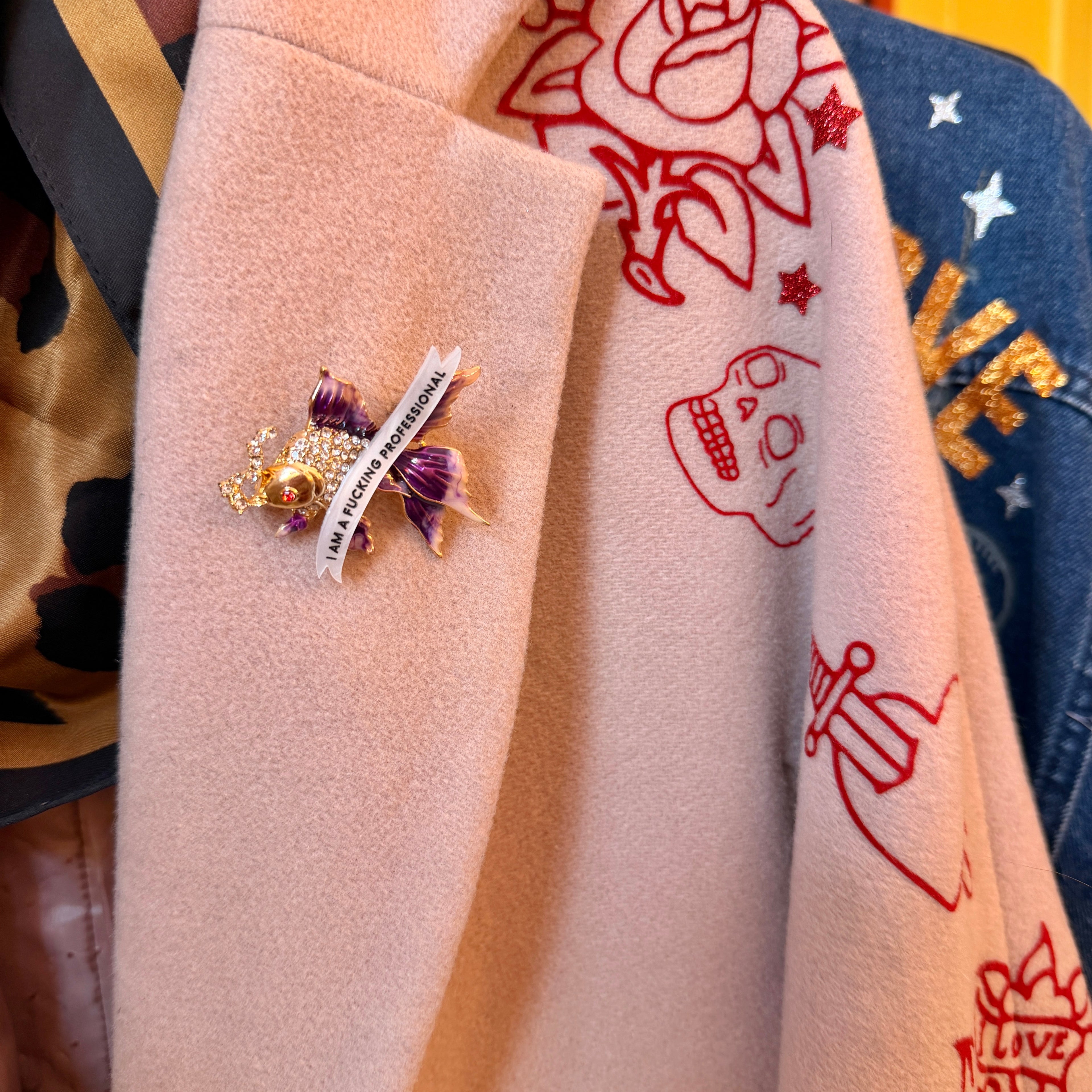 I am a fucking professional, diamanté fish pin
