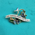 The horrors persist… bird brooch