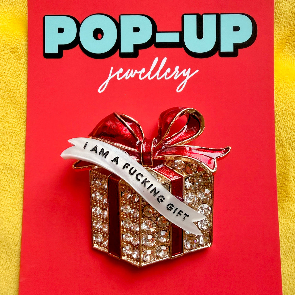 I am an actual Fucking GIFT!, diamanté present pin (version 2)
