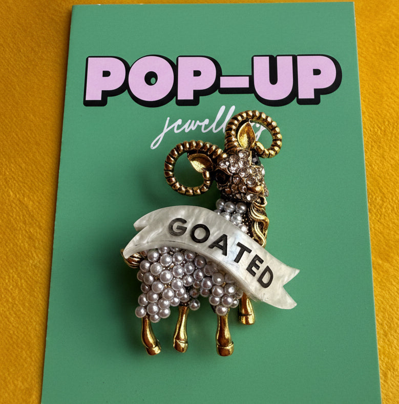 GOATED diamanté pin