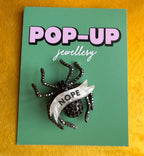 NOPE spider diamanté pin