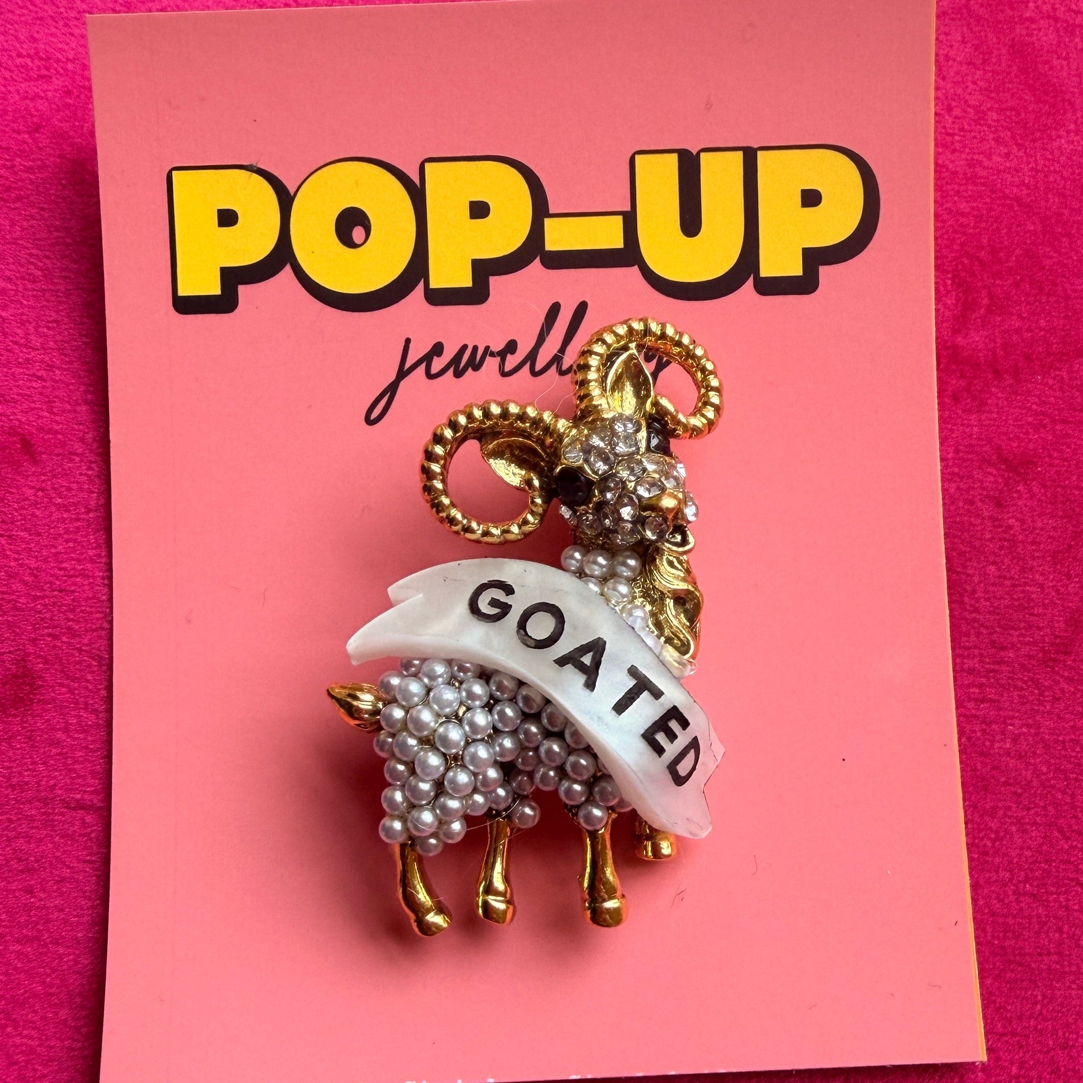 GOATED diamanté pin