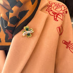 LUCKY FUCKER, diamanté shamrock pin.